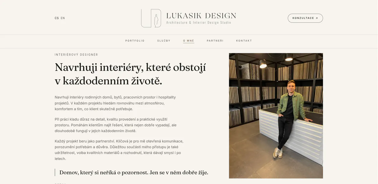 Lukasik Design about page: the designer photographed in a materials showroom beside his approach to interiors